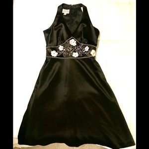 Black satin/white embroidered cocktail dress.